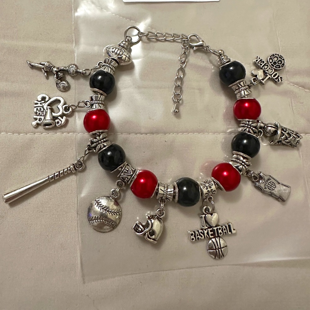 Handmade – NWOT – Sterling silver plated charm bracelet. Red/black beads sporty.